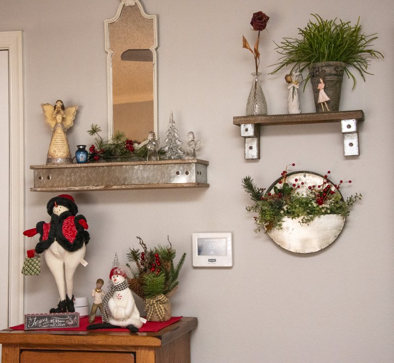 Geri Ludlam and Connie Heindel delight visitors with their collection of snow people at their home on Hudson Road.
